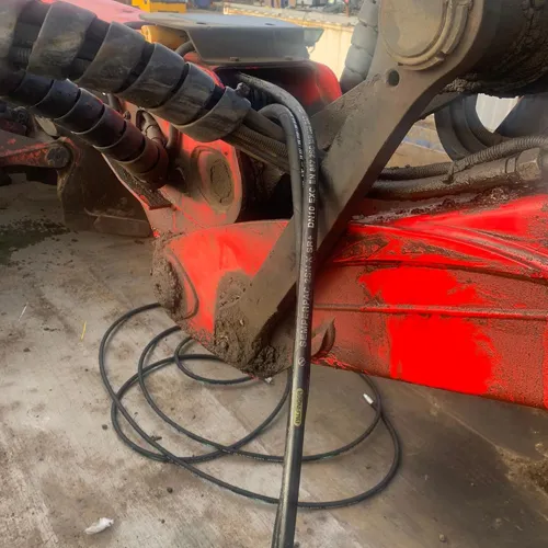 A close up of a machine with a hose connected to it.